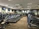 Well-equipped gym featuring treadmills, fans, televisions, and mirrored walls at 20524 W Nelson Pl, Buckeye, AZ 85396