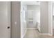 Bright bathroom featuring a tile floor, a walk-in shower with glass doors, and a white vanity with drawers at 21323 N 61St St, Phoenix, AZ 85054