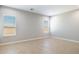 Bedroom with tile floors, base molding, and natural light from two windows at 21323 N 61St St, Phoenix, AZ 85054