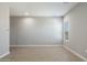 Bright bedroom with base molding, tile floors, and natural lighting from a window at 21323 N 61St St, Phoenix, AZ 85054