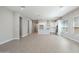 Open living room featuring tile flooring with an adjacent kitchen space at 21323 N 61St St, Phoenix, AZ 85054