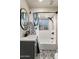 Bathroom featuring a shower-tub combo, a black framed oval mirror, and modern fixtures at 2201 N 17Th Ave, Phoenix, AZ 85007