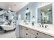 Bathroom featuring a claw foot tub, double sink vanity and modern fixtures at 2201 N 17Th Ave, Phoenix, AZ 85007