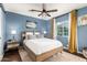 Calm primary bedroom featuring a ceiling fan, a queen bed, and natural light through the window at 2201 N 17Th Ave, Phoenix, AZ 85007