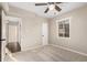 Bedroom featuring neutral walls and carpet, a ceiling fan, and access to the bathroom at 2201 N 17Th Ave, Phoenix, AZ 85007