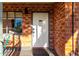 Detailed view of the front door and brick exterior showcasing the entryway's charm and character at 2201 N 17Th Ave, Phoenix, AZ 85007