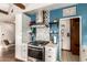 Cozy kitchen with stainless steel oven, marble countertops, and an open doorway at 2201 N 17Th Ave, Phoenix, AZ 85007