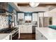 Updated kitchen featuring white cabinets, stainless steel appliances, and stylish backsplash at 2201 N 17Th Ave, Phoenix, AZ 85007