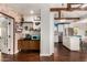 Open-concept area with a decorative coffee station, that leads into the kitchen, featuring white cabinets and stainless appliances at 2201 N 17Th Ave, Phoenix, AZ 85007