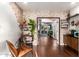 Inviting living room with hardwood floors, brick accent wall, and seamless transition to the outdoor space at 2201 N 17Th Ave, Phoenix, AZ 85007