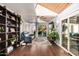 Spacious living room with a vaulted wood ceiling, ceiling fan, and large sliding doors to the backyard at 2201 N 17Th Ave, Phoenix, AZ 85007