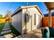 Backyard view of a convenient outbuilding with neutral paint, a window, and a door at 2201 N 17Th Ave, Phoenix, AZ 85007