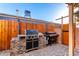 Outdoor kitchen featuring a built-in grill and additional cooking equipment, perfect for backyard entertaining at 2201 N 17Th Ave, Phoenix, AZ 85007