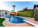 Sparkling swimming pool with diving board, surrounded by lush greenery and a well-maintained deck at 2201 N 17Th Ave, Phoenix, AZ 85007