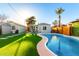 Beautiful swimming pool with artificial grass landscaping, perfect for Gathering fun and outdoor enjoyment at 2201 N 17Th Ave, Phoenix, AZ 85007