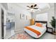 A bedroom with a ceiling fan, dresser, and a colorful patterned rug at 2205 W Cambridge Ave, Phoenix, AZ 85009