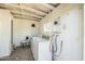 Laundry room with a washer, dryer, and vintage white walls at 2205 W Cambridge Ave, Phoenix, AZ 85009