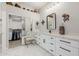 Bright bathroom with an abundance of counterspace, stylish fixtures, and a walk-in closet at 22222 N 54Th Way, Phoenix, AZ 85054