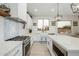 Well-lit kitchen showcasing white cabinetry, stainless steel appliances, and a sleek design at 22222 N 54Th Way, Phoenix, AZ 85054