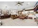 Inviting open-plan living room with a dining area, natural light, and a neutral color palette at 22222 N 54Th Way, Phoenix, AZ 85054