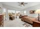 Spacious main bedroom featuring large windows, seating area, and neutral color scheme at 22222 N 54Th Way, Phoenix, AZ 85054