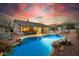 Backyard with a freeform pool, desert landscaping and outdoor fireplace at 22222 N 54Th Way, Phoenix, AZ 85054