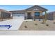 Charming single-story home with neutral tones, a two car garage and rock landscaping at 24192 W Agora Ln, Buckeye, AZ 85326