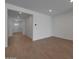 Inviting living room with neutral walls, tile floors, and a welcoming front door at 24192 W Agora Ln, Buckeye, AZ 85326