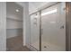 Bathroom with walk-in shower with white subway tile and glass door at 24192 W Agora Ln, Buckeye, AZ 85326