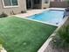 Outdoor entertaining area includes a refreshing pool, green turf and decorative landscape at 24478 N 166Th Ave, Surprise, AZ 85387