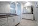 Spacious bathroom featuring tiled floors, double vanity with granite counters, and a glass enclosed shower at 24478 N 166Th Ave, Surprise, AZ 85387