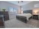 Cozy bedroom with neutral colors, soft carpet, and ample natural light from a large window at 24478 N 166Th Ave, Surprise, AZ 85387