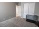 Neutral bedroom with carpet, closet, and attached bathroom provides a clean and peaceful space at 24478 N 166Th Ave, Surprise, AZ 85387