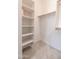 An organized closet with built-in shelving and rods provides ample storage space at 24478 N 166Th Ave, Surprise, AZ 85387