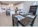 Open dining space connected to kitchen featuring modern table and decor at 24478 N 166Th Ave, Surprise, AZ 85387