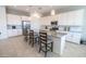 Modern kitchen featuring white cabinets, granite countertops, and pendant lighting at 24478 N 166Th Ave, Surprise, AZ 85387