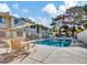 A community pool featuring plenty of chairs and tables for residents' enjoyment at 2549 W Rose Ln # A223, Phoenix, AZ 85017