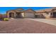 Inviting single-story home with desert landscaping, a two-car garage, and a charming entrance at 25797 W St Charles Ct, Buckeye, AZ 85326