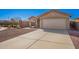 Well-maintained single-story home with desert rock landscaping and a spacious driveway at 25797 W St Charles Ct, Buckeye, AZ 85326