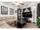 Cozy living room featuring tile floors, a ceiling fan, and comfortable seating at 25797 W St Charles Ct, Buckeye, AZ 85326