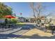 Backyard featuring gravel, patio furniture, grill and grassy lawn at 2719 N Greenfield Rd, Phoenix, AZ 85006