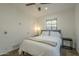 Bedroom with fan, natural light, and painted concrete floor at 2719 N Greenfield Rd, Phoenix, AZ 85006