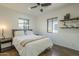 Bedroom with ceiling fan, natural light, and painted concrete floor at 2719 N Greenfield Rd, Phoenix, AZ 85006