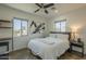 Serene bedroom with natural light, modern ceiling fan, and minimalist decor at 2719 N Greenfield Rd, Phoenix, AZ 85006