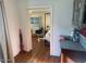 Bedroom with white brick walls and wood floors, visible through doorway at 2719 N Greenfield Rd, Phoenix, AZ 85006