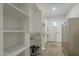 Spacious walk-in closet with custom shelving, ample storage and natural light at 2719 N Greenfield Rd, Phoenix, AZ 85006