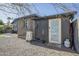 Back exterior showcasing shed with white door and water heater at 2719 N Greenfield Rd, Phoenix, AZ 85006