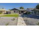 Charming home featuring manicured landscaping, gravel, and a modern walkway leading to the entrance at 2719 N Greenfield Rd, Phoenix, AZ 85006