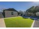 Charming home featuring manicured landscaping, artificial turf, and a modern walkway leading to the entrance at 2719 N Greenfield Rd, Phoenix, AZ 85006