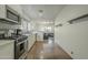 Modern kitchen with stainless steel appliances and view of the living room at 2719 N Greenfield Rd, Phoenix, AZ 85006